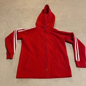 Red Iconic boys jacket with white lines on sleeves.